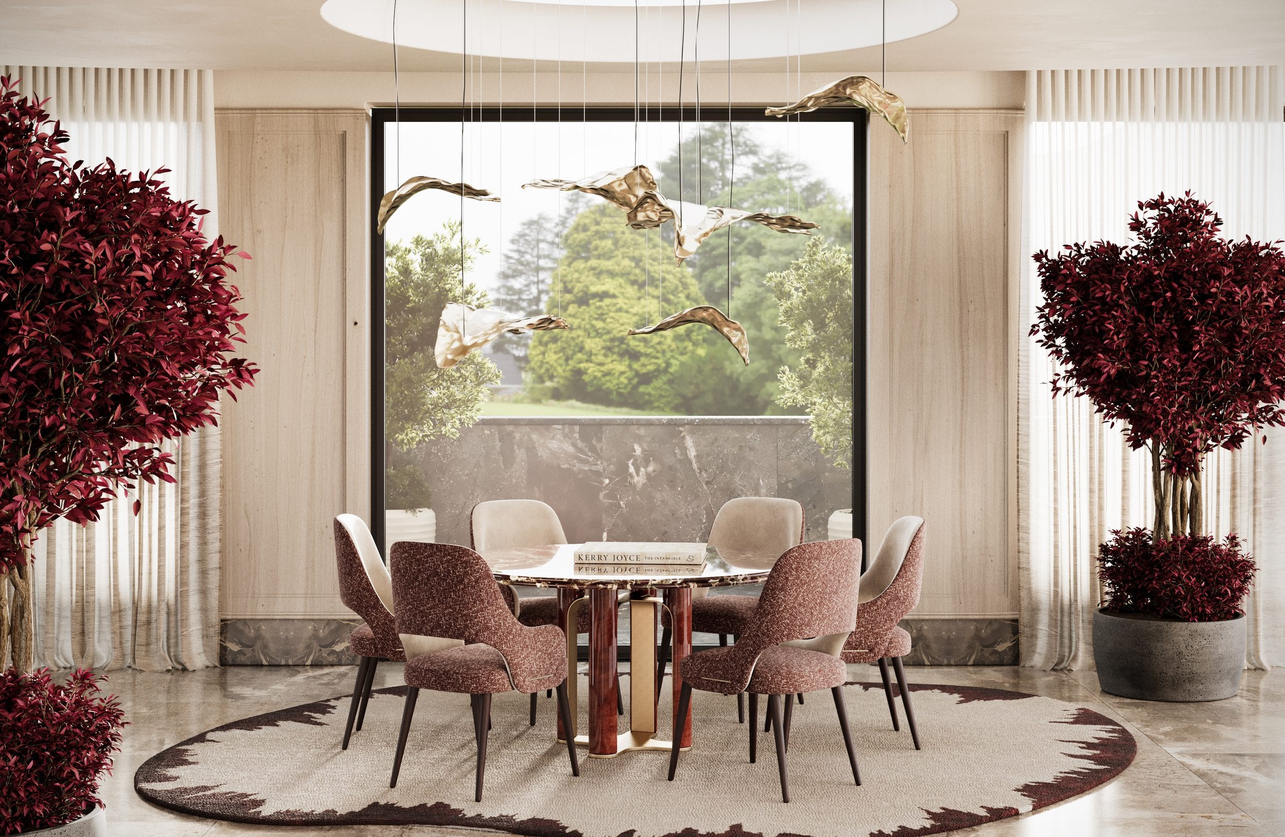 Round marble dining table laid for six in a travertine room, brass bird lights suspended above